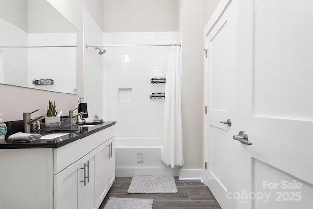 bathroom featuring vanity and shower / bath combo