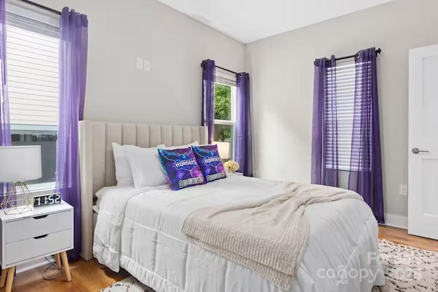 bedroom with hardwood / wood-style flooring