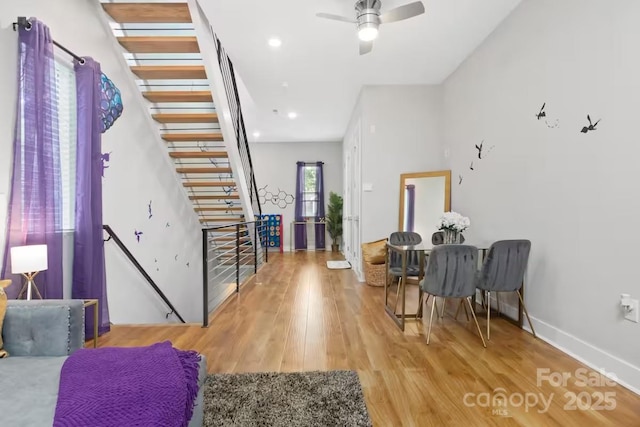 entrance foyer with wood-type flooring and ceiling fan