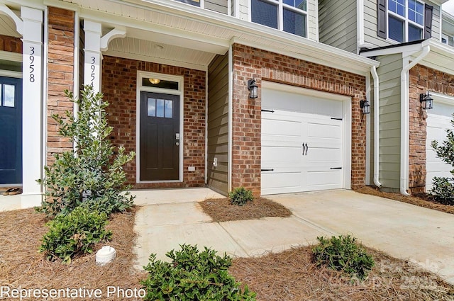 view of exterior entry featuring a garage