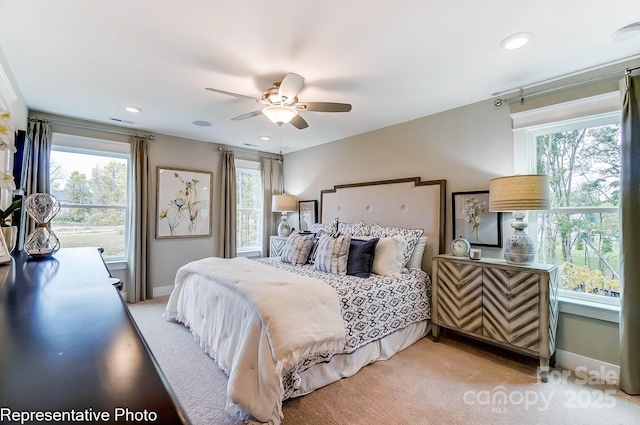 carpeted bedroom featuring ceiling fan