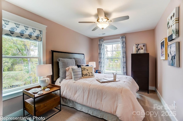 bedroom with light colored carpet and ceiling fan