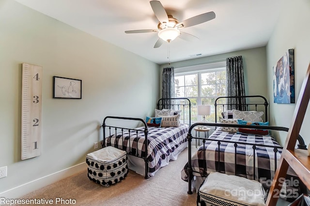 bedroom featuring ceiling fan and carpet