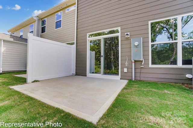 exterior space featuring a yard and a patio area