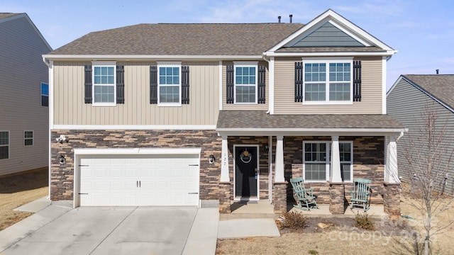 craftsman house with a garage and covered porch