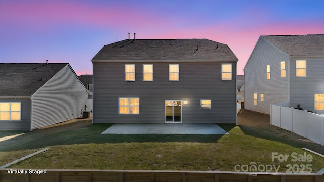 rear view of house with cooling unit, a patio, fence, and a lawn