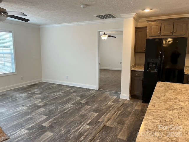 kitchen featuring light countertops, black fridge with ice dispenser, visible vents, ornamental molding, and ceiling fan