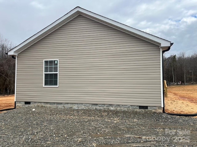 view of side of property featuring crawl space