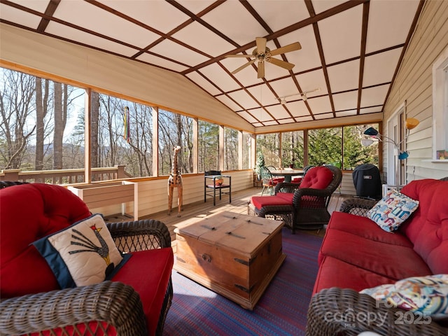 wooden terrace featuring outdoor lounge area and a ceiling fan