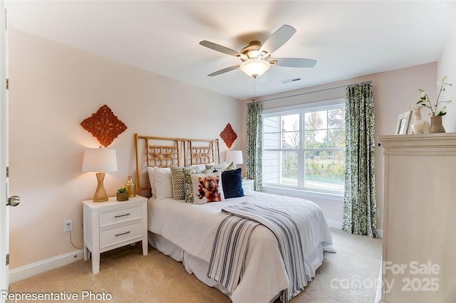 bedroom featuring ceiling fan and light colored carpet