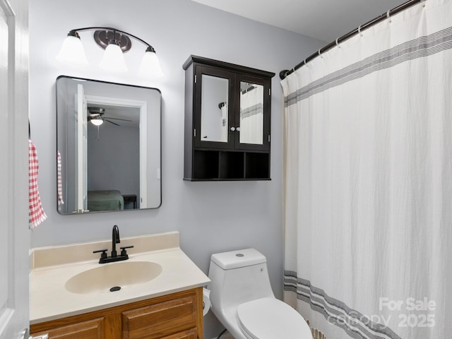 bathroom featuring vanity and toilet