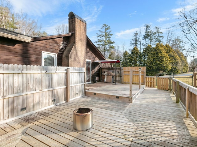 wooden deck featuring grilling area