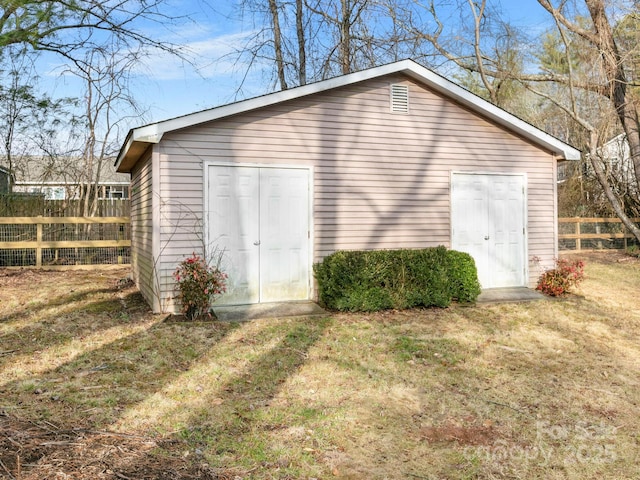 view of outdoor structure featuring a lawn