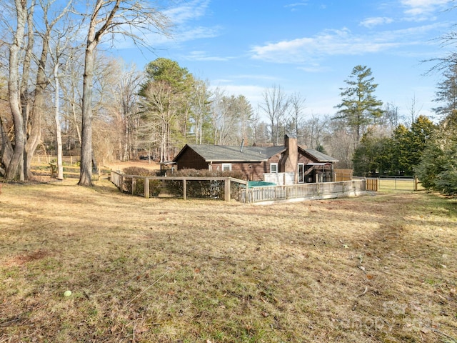 view of yard featuring a covered pool