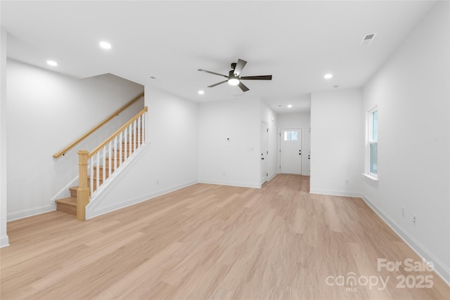 unfurnished living room with ceiling fan and light hardwood / wood-style flooring