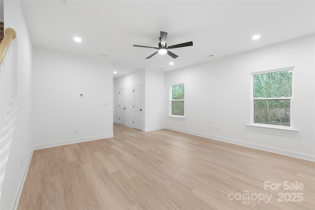 empty room featuring ceiling fan and light hardwood / wood-style flooring