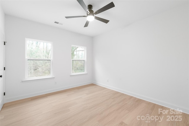 unfurnished room with ceiling fan and light hardwood / wood-style flooring