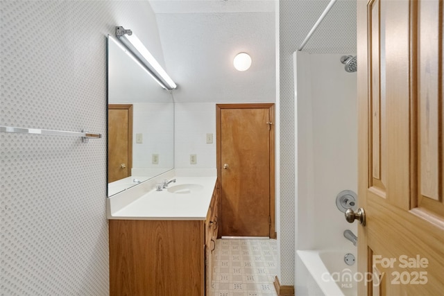 bathroom with vanity and  shower combination