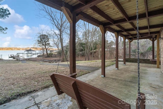 view of patio with a water view