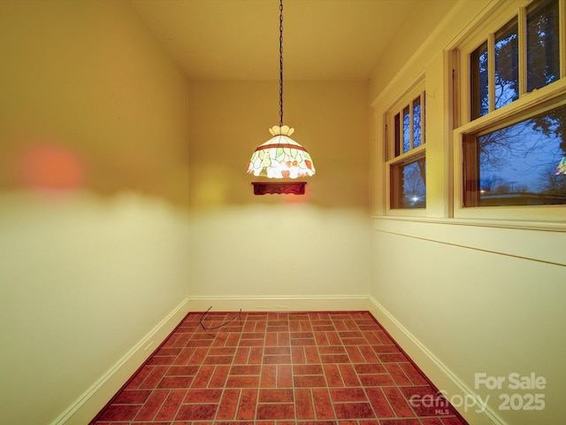 113 2nd St, Spencer, NC 28159 - empty room with brick patterned flooring and baseboards