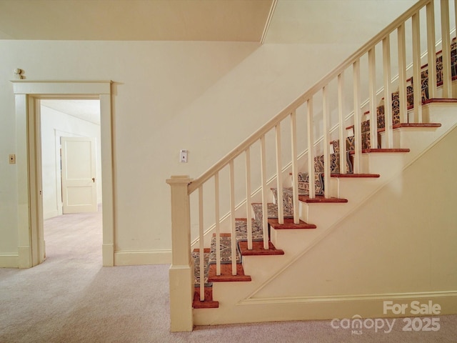 113 2nd St, Spencer, NC 28159 - stairway with carpet flooring and baseboards