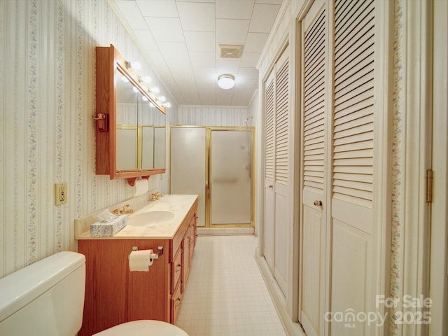 113 2nd St, Spencer, NC 28159 - bathroom with wallpapered walls, a closet, toilet, vanity, and a shower stall