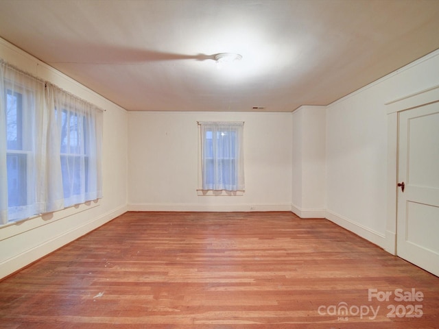 113 2nd St, Spencer, NC 28159 - empty room with light wood-style flooring and baseboards