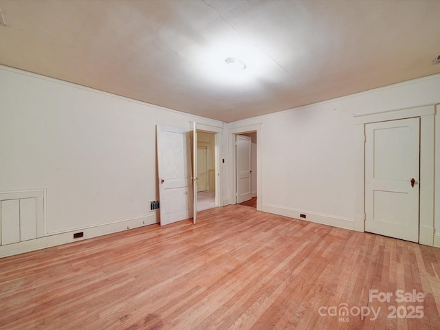 113 2nd St, Spencer, NC 28159 - spare room with light wood-type flooring and baseboards