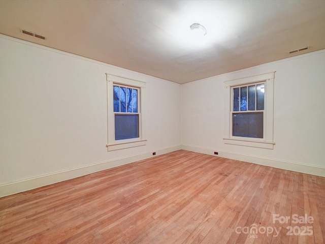 113 2nd St, Spencer, NC 28159 - spare room with light wood-type flooring and baseboards
