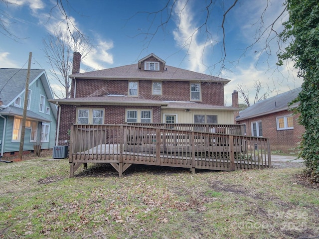 113 2nd St, Spencer, NC 28159 - back of house featuring brick siding, a wooden deck, central AC, and a chimney