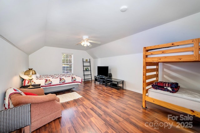 bedroom featuring wood-type flooring, lofted ceiling, and ceiling fan