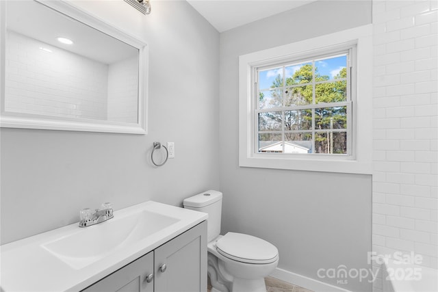 bathroom featuring vanity and toilet