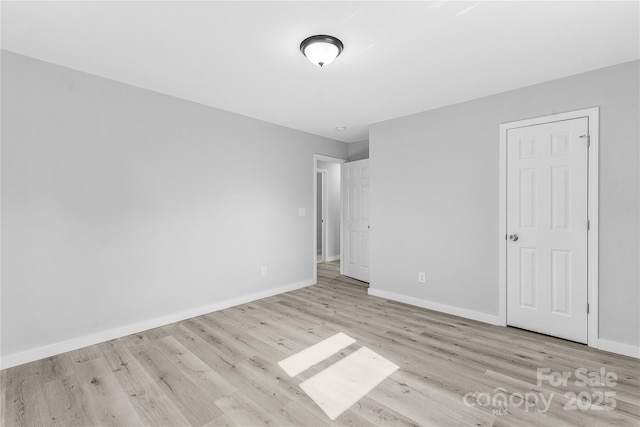 unfurnished bedroom with light wood-type flooring