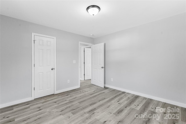 unfurnished bedroom with light hardwood / wood-style floors