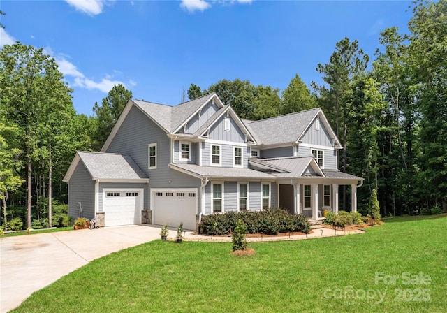 view of front of house featuring a garage and a front yard