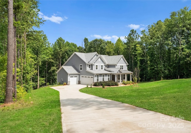 view of front of house with a garage and a front yard