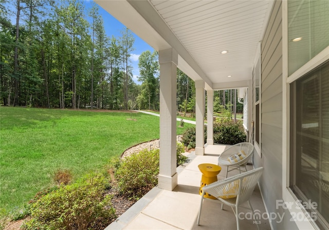 view of yard with covered porch