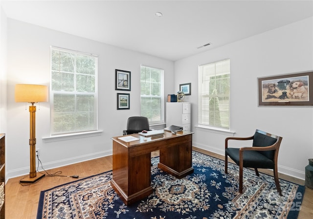 office area with wood-type flooring