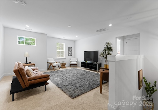 living room with light colored carpet