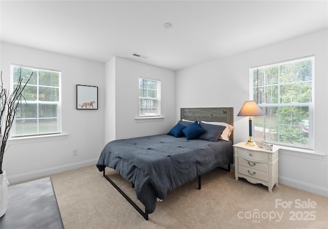 bedroom with light colored carpet