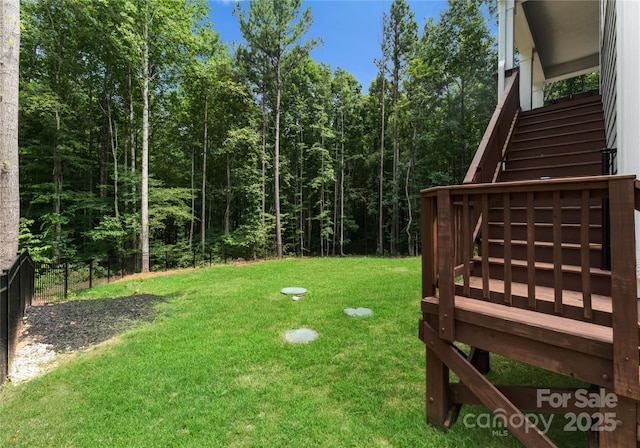 view of yard with a wooden deck