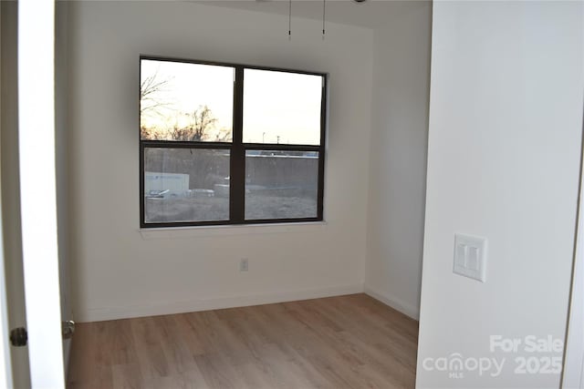 unfurnished room featuring light hardwood / wood-style flooring