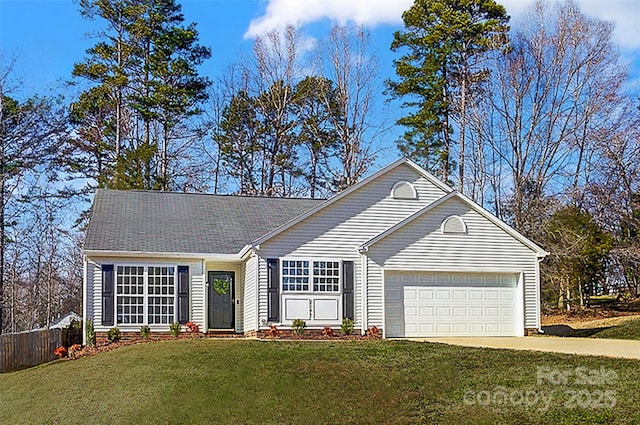 ranch-style house with a front yard, driveway, an attached garage, and fence