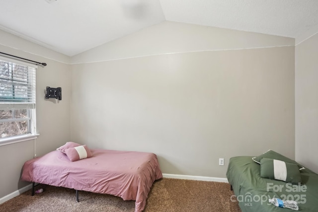 carpeted bedroom featuring lofted ceiling