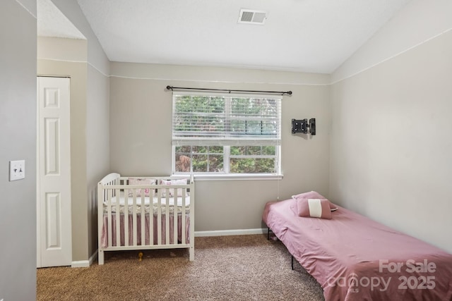 carpeted bedroom featuring lofted ceiling