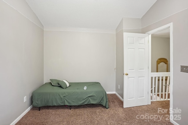 carpeted bedroom with vaulted ceiling