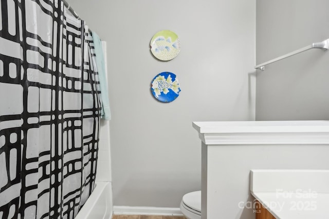 full bathroom featuring vanity, shower / tub combo with curtain, and toilet