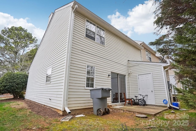 back of house with a patio area