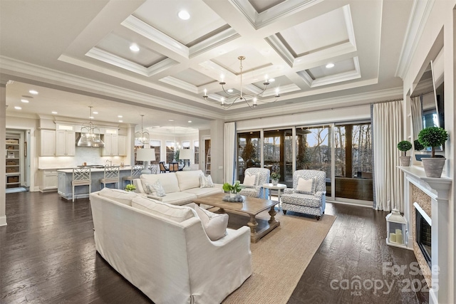 living room featuring beamed ceiling, ornamental molding, coffered ceiling, a notable chandelier, and dark wood-type flooring