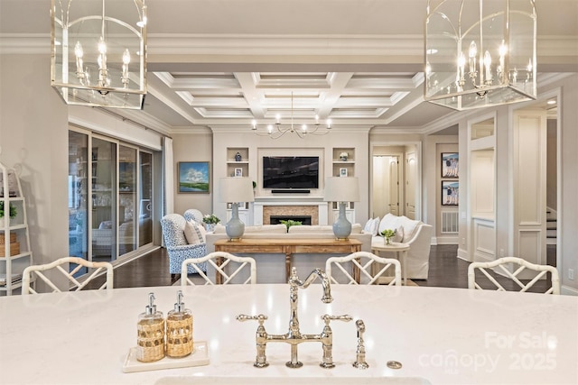 dining space with an inviting chandelier and ornamental molding